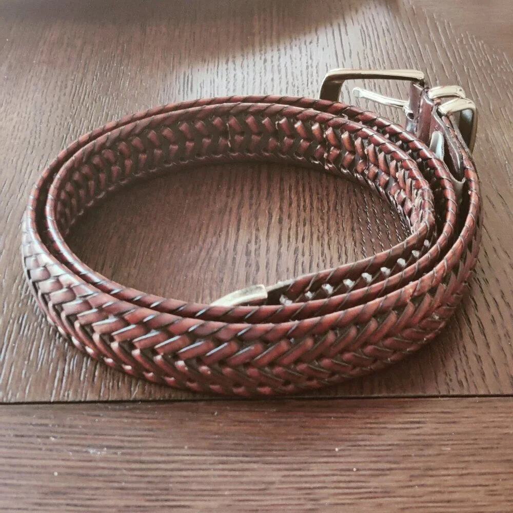 Leather Belt by Perry Ellis in a woven design with a belt buckle in Silver